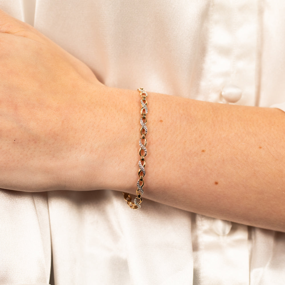 Exquisite 9 Carat Yellow Gold Diamond Infinity Bracelet Adorned with 6 Round Cut Diamonds
