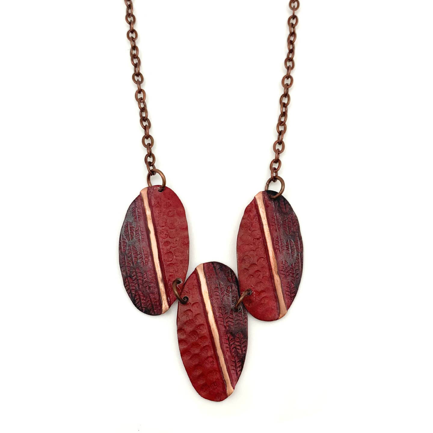 Stylish Copper Patina Necklace with Bold Red Feathers and Circular Designs