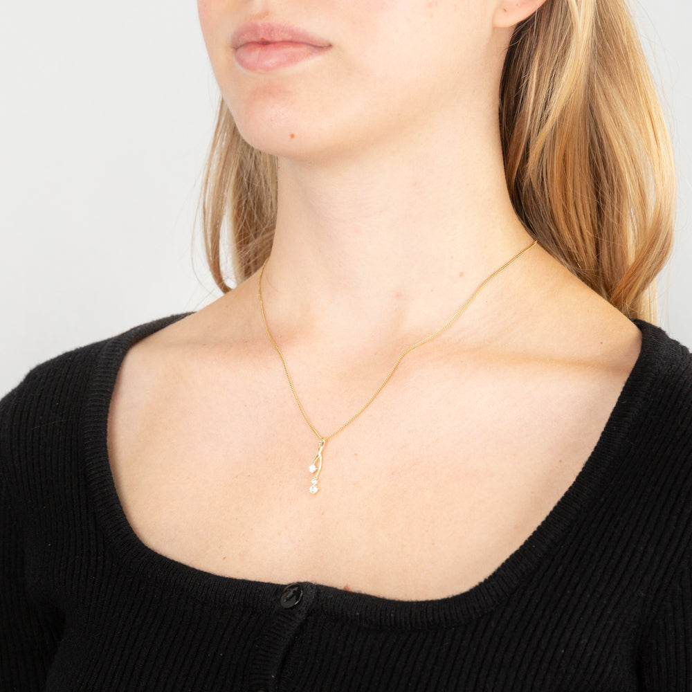 Exquisite 9 Carat Yellow Gold Cubic Zirconia Twisted Slider Pendant for a Fashion Statement